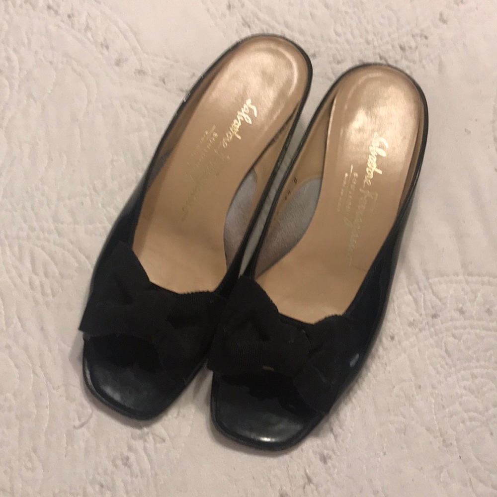 Gently worn Ferragamo slides with bow.